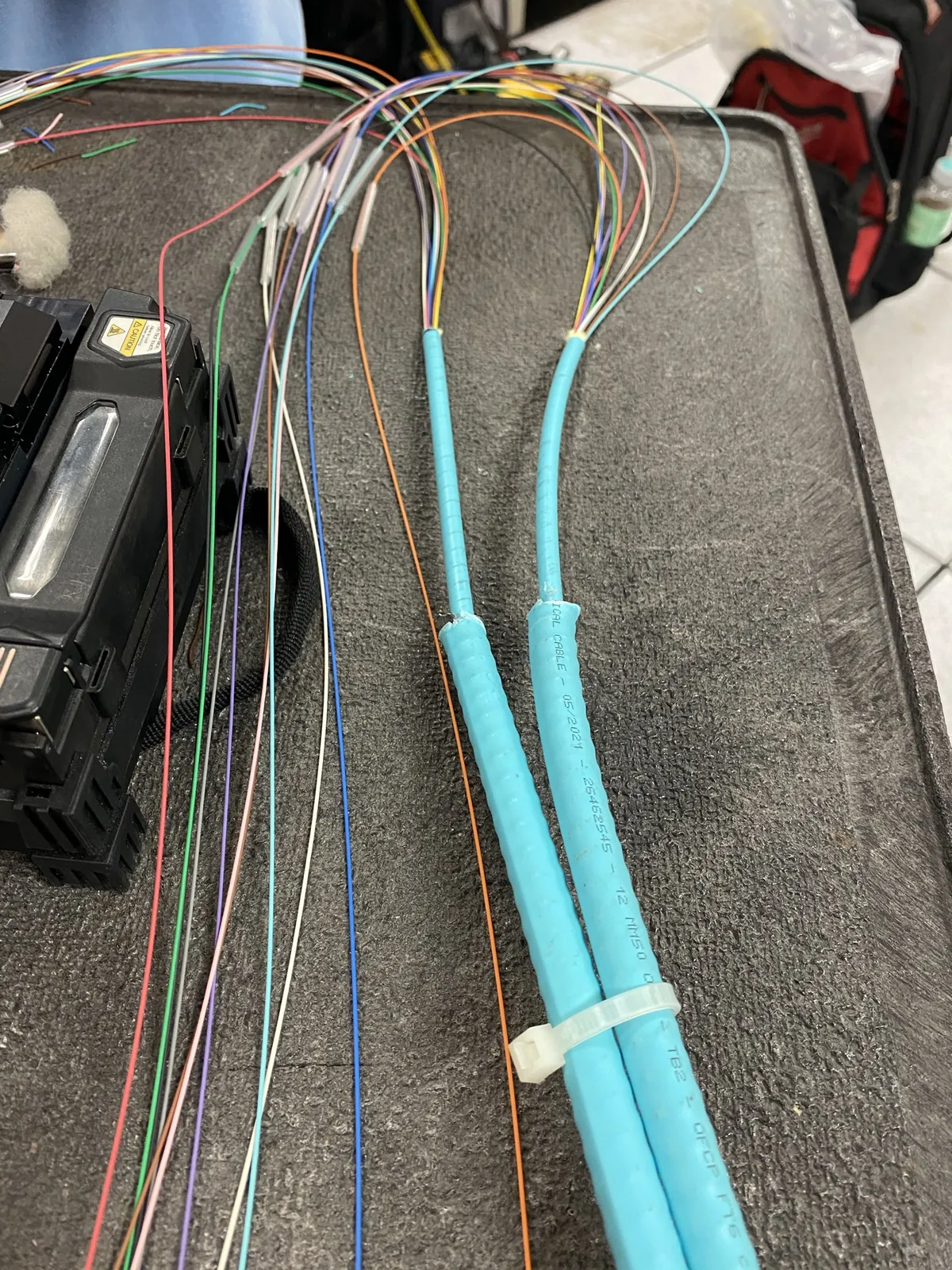 Buffered fiber strands routed from protective innerduct for termination at a Data Pro Communications project in Orlando, FL