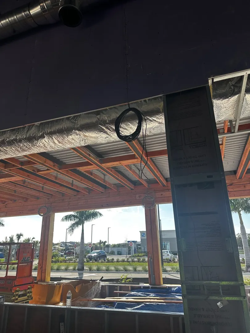 Cable coil staged at open steel framing during build-out at a Data Pro Communications project in Orlando, FL