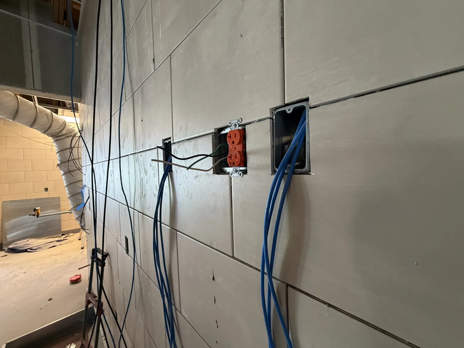 Low-voltage cabling rough-in at wall boxes during a commercial renovation at a Data Pro Communications project in Orlando, FL