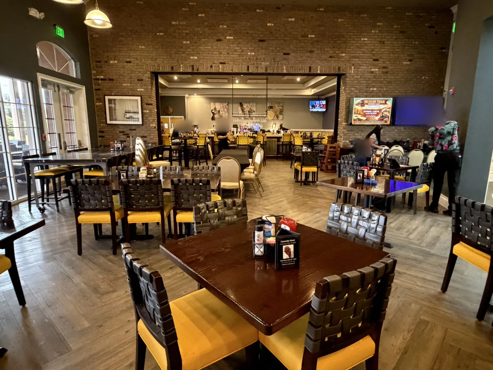 Restaurant dining area with integrated commercial technology at a Data Pro Communications project in Orlando, FL