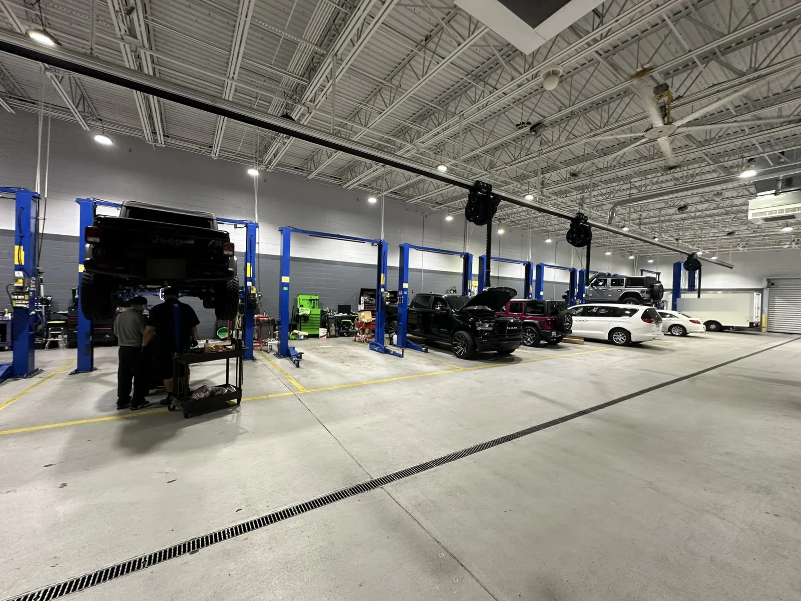 High-bay operations floor with overhead network pathways at a Data Pro Communications project in Orlando, FL