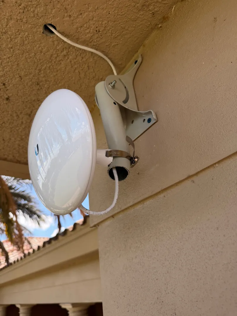 airMAX NanoStation PtP antenna on eave at a Data Pro Communications project in Groveland, FL