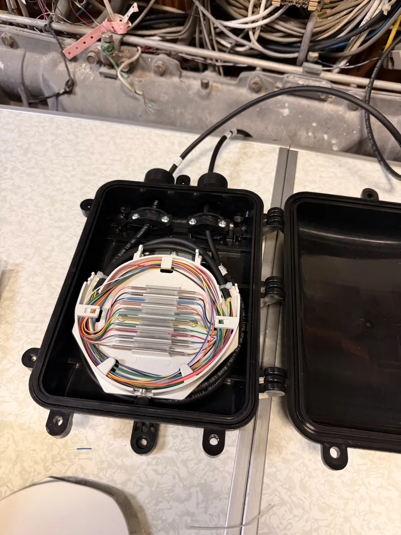 Fiber drop enclosure (DFE) open at a Data Pro Communications project in Key West, FL