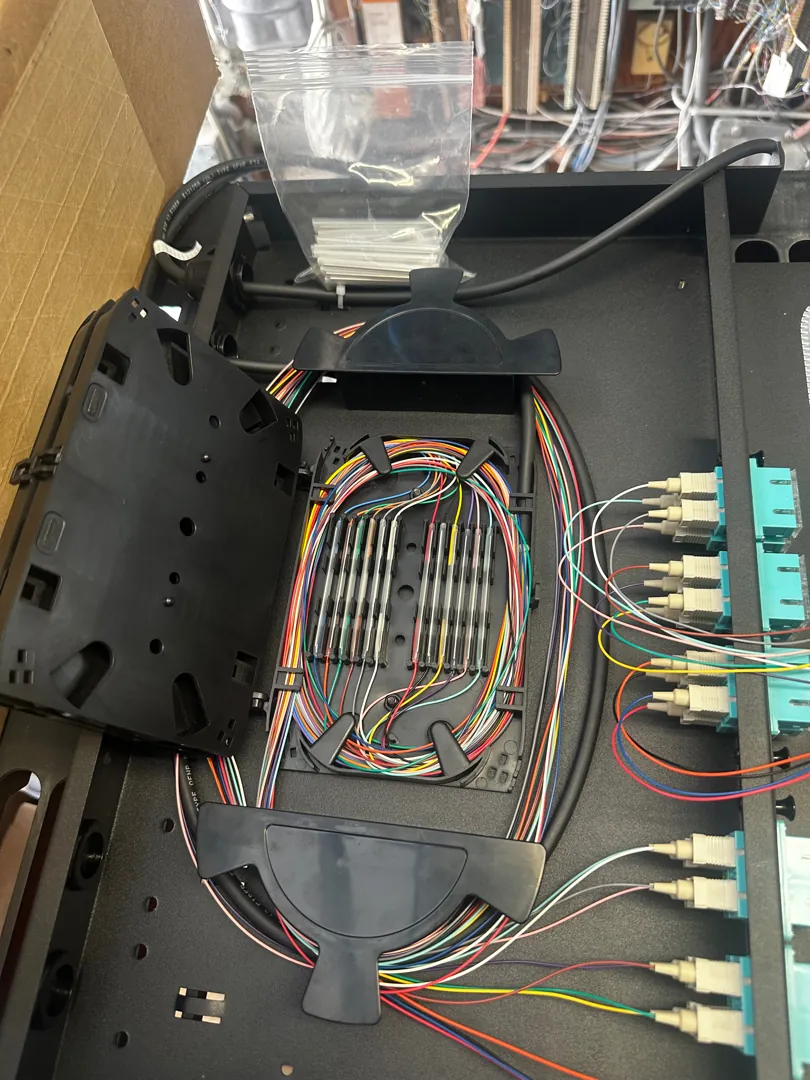 Fiber splice enclosure open at a Data Pro Communications project in Key West, FL