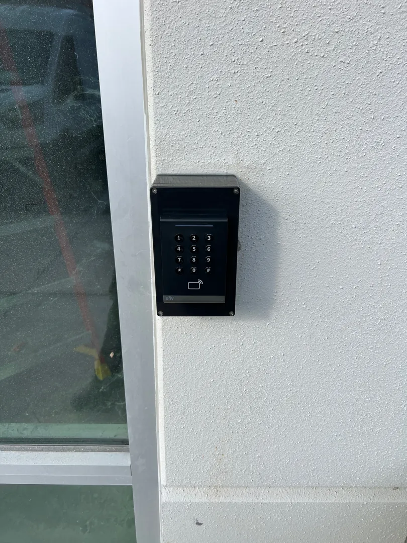 Card reader on door frame at a Data Pro Communications project in Palmetto, FL