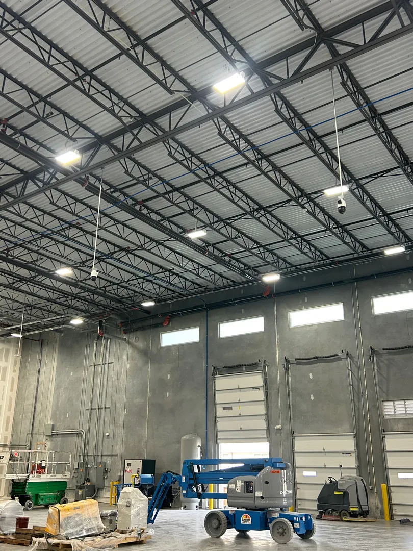 Warehouse interior w/ lift (context) at a Data Pro Communications project in Palmetto, FL