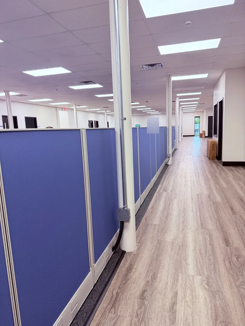Cubicle aisle w/ column conduit at a Data Pro Communications project in Auburndale, FL