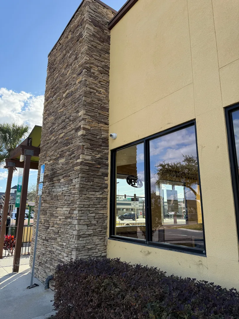 Exterior wall camera w/ stone column at a Data Pro Communications project in Orlando, FL