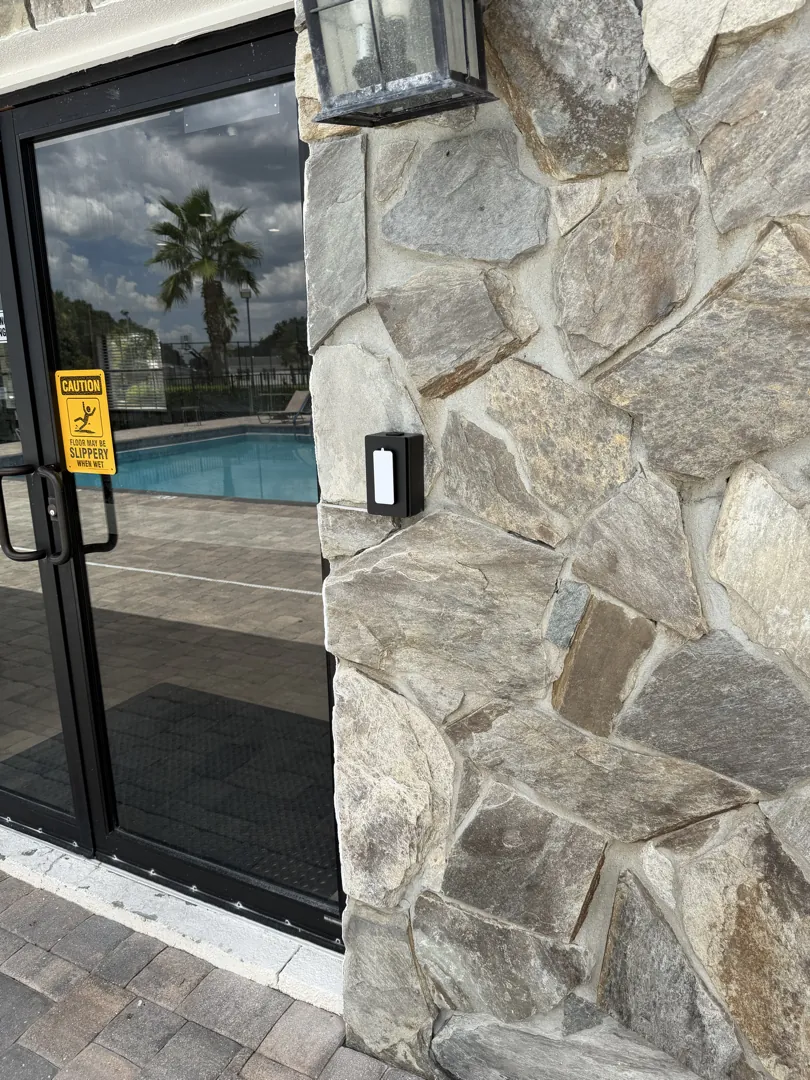 Pool door reader on stone at a Data Pro Communications project in Davenport, FL