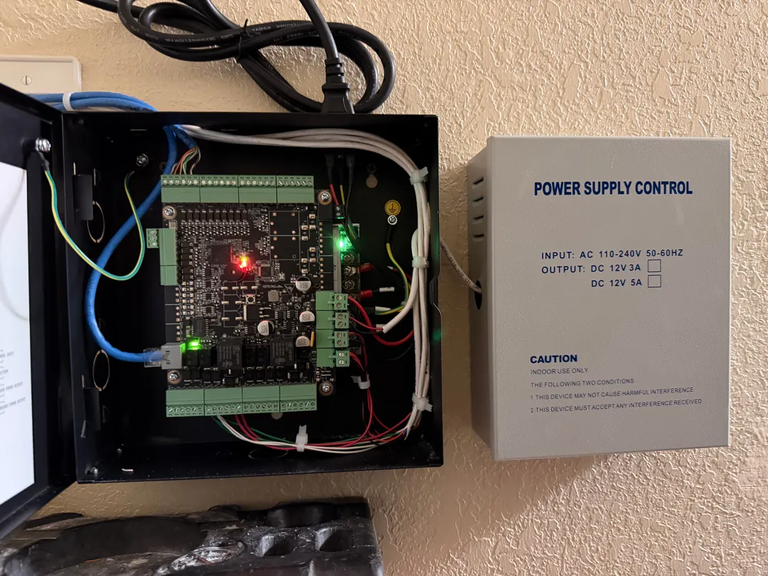 Access controller board open w/ PSU at a Data Pro Communications project in Kissimmee, FL